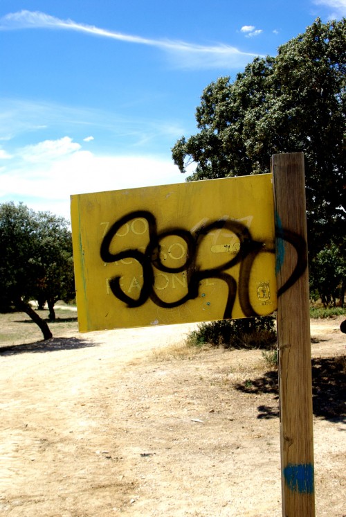 Graffiti on zoo sign; Madrid, Spain