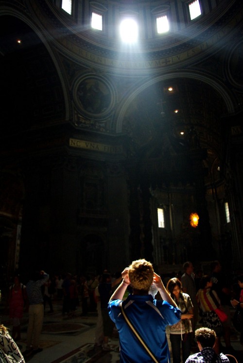 Blue shirt and ray of sun in the Vatican