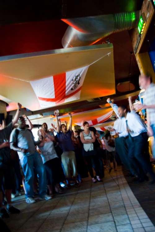 People in London watch England scores goal in World Cup.